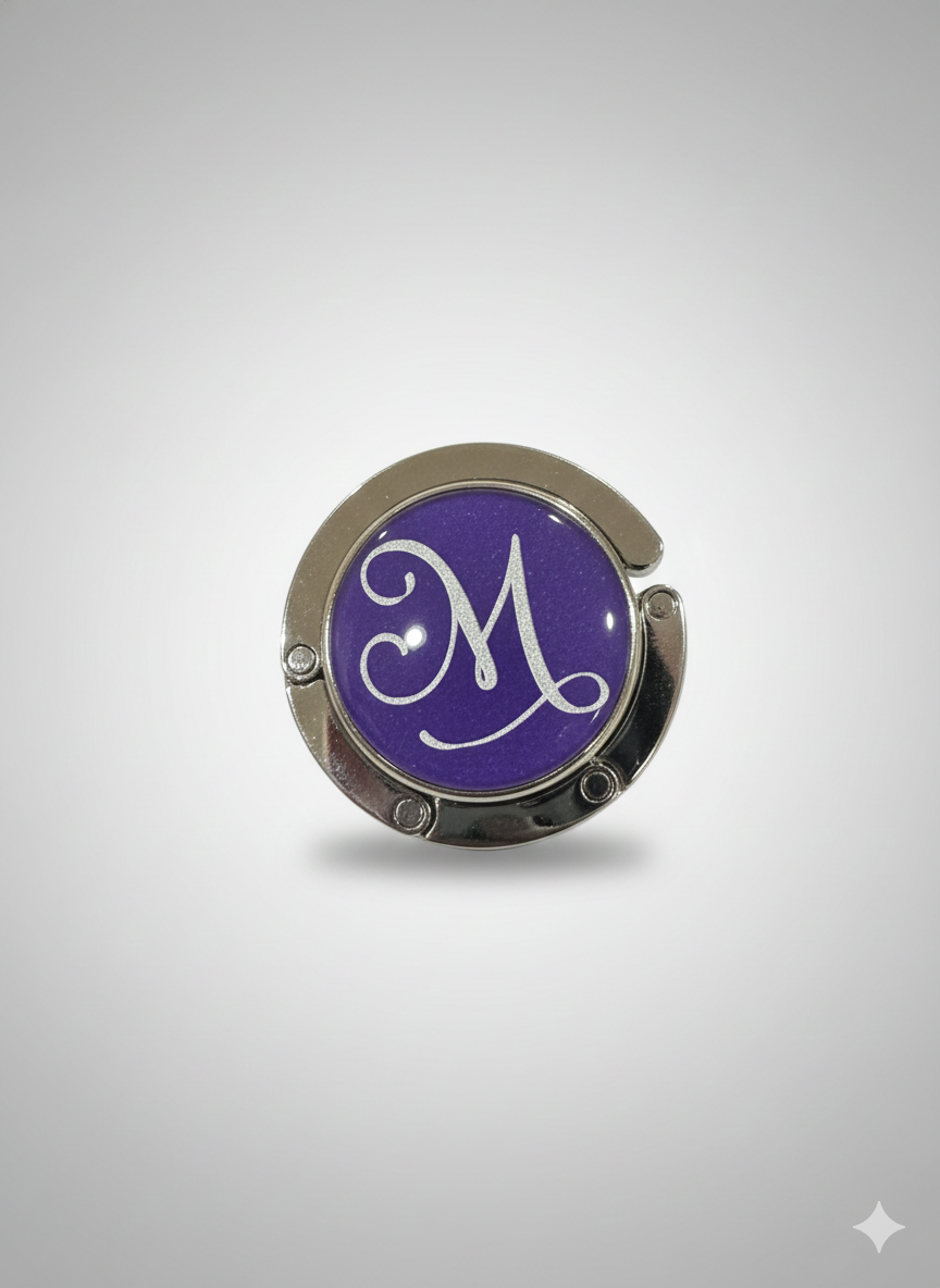 Round purple object with a white letter 'M' on a gray background