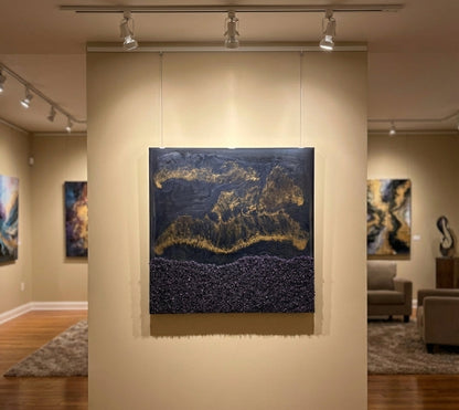 Art gallery with abstract paintings on beige walls