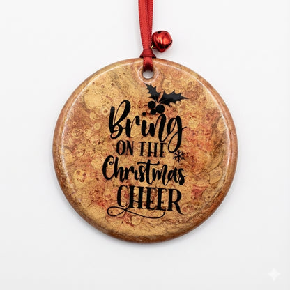 Round Christmas ornament with 'Bring on the Christmas Cheer' text and holly design.