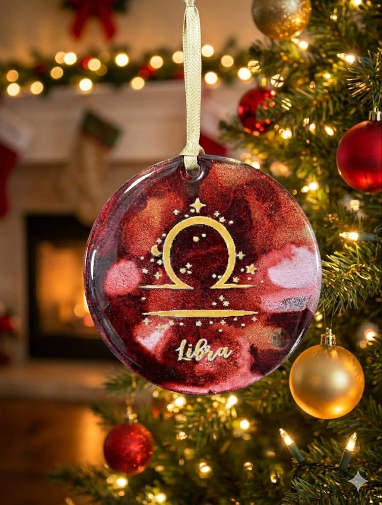 Decorative Libra zodiac ornament on a Christmas tree with festive background
