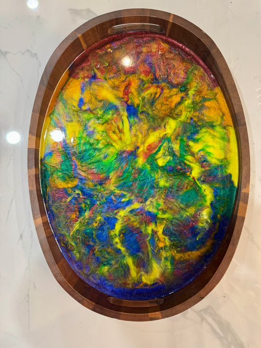 Colorful abstract art piece tray in a wooden frame on a marble surface