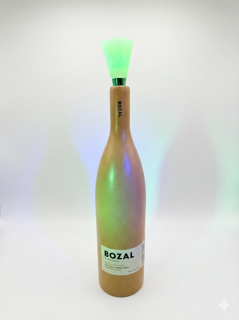 Bottle with a colorful label and BOZAL branding on a white background