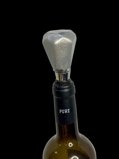Wine bottle stopper with geometric design on a white background