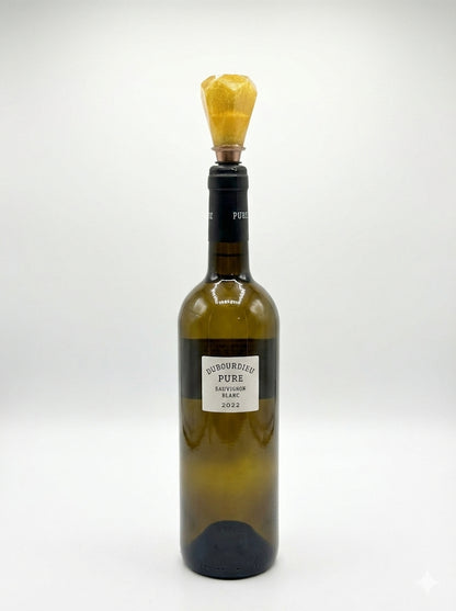 Wine bottle with a yellow foil cap on a white background