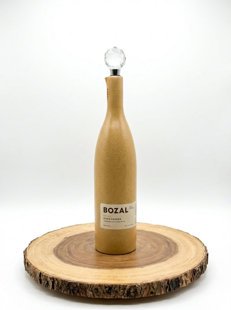 Wooden wine bottle-shaped object with a label on a wooden coaster against a white background