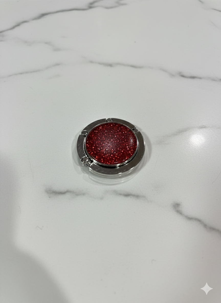 Red glittery bag holder on a marble surface